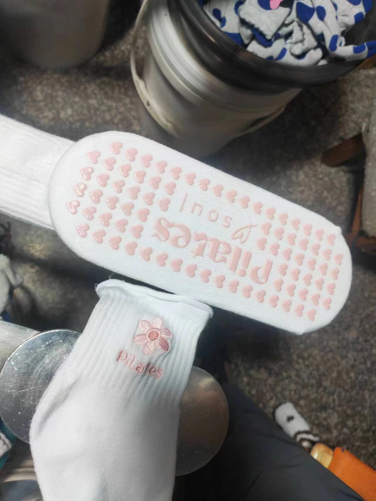 Grip dot printing machine in production with custom Pilates socks