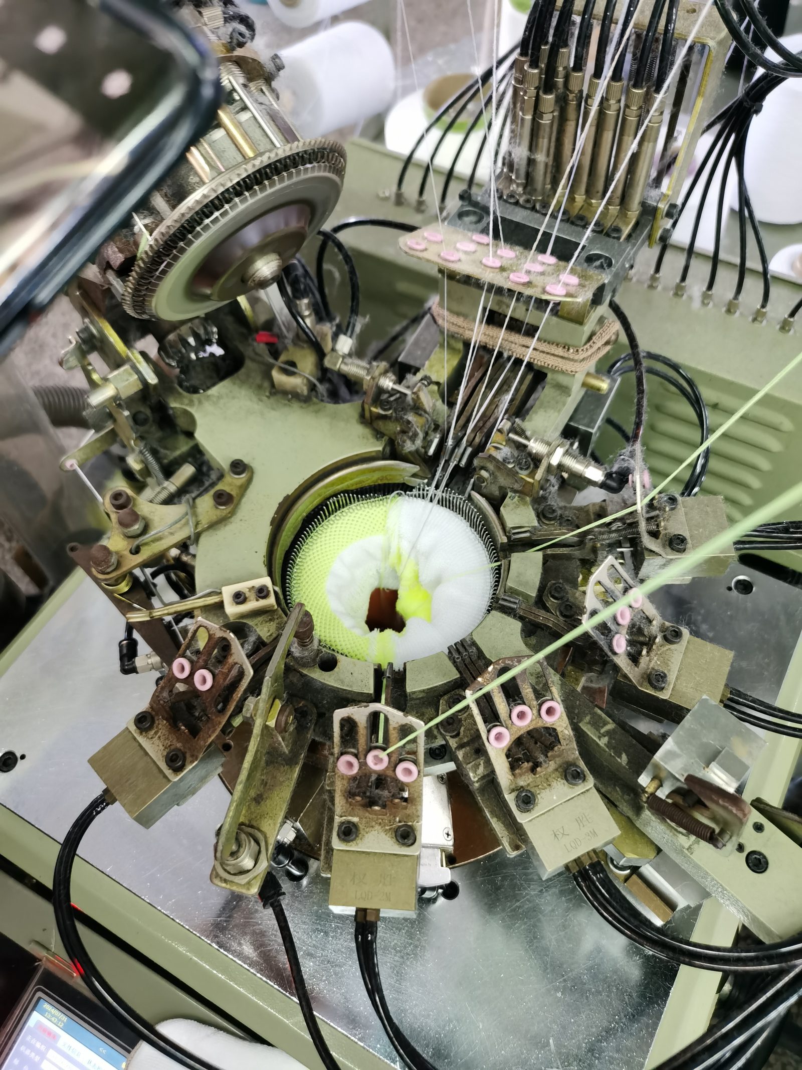 Sock knitting machine in action